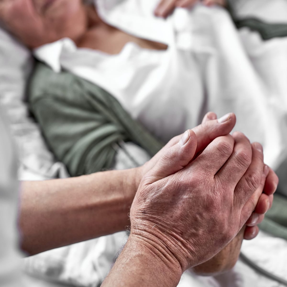 Close up of hands being held